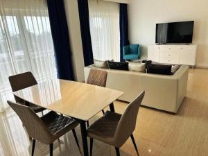 a living room with a table and a couch at Tinian diamond hotel in Tinian International Airport