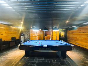 a pool table in a room with a ceiling at Phủ Homestay Sapa in Sapa +21 photos