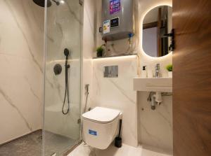 a bathroom with a toilet and a shower and a sink at Elegant Studio in Casablanca in Casablanca