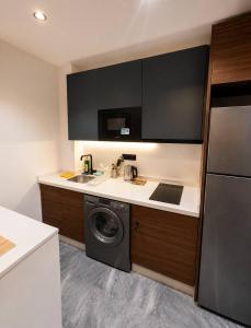a kitchen with a sink and a washing machine at Elegant Studio in Casablanca in Casablanca