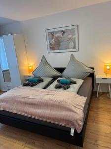 a large bed with two pillows on top of it at Elbstone 1 in Wittenberge