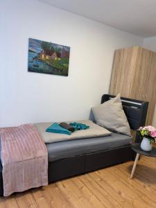 a couch in a room with a painting on the wall at Elbstone 1 in Wittenberge