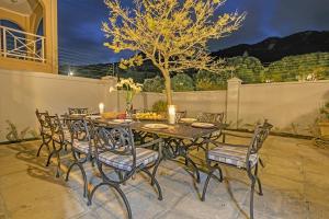 a table and chairs sitting on a patio at Bed and Breakfast Villa de la Mer in Hout Bay