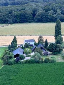 an aerial view of a house in a field at Quo Vadis in Lengel