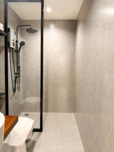 a shower with a glass door in a bathroom at Into the town krabi in Krabi +57 photos