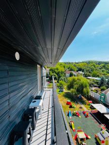 a balcony with a view of a toy train yard at Antonia home 2 in Târgu-Mureş
