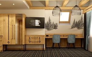 a meeting room with two chairs and a desk at Ku Dolinie in Kościelisko +69 photos
