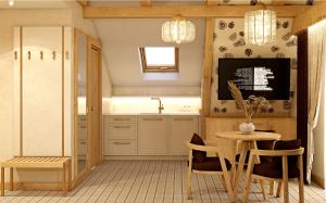 a kitchen with a table and chairs and a tv at Ku Dolinie in Kościelisko