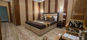 a bedroom with a large bed in a room at The White Yak Hotel in Leh