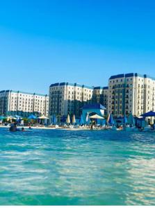 a view of a city from the water with buildings at Cozy studio in sahel in El Alamein +17 photos
