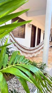 a view of the lobby of a resort with a hammock at Pousada Jangá Jeri in Jericoacoara