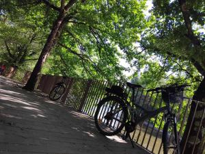 a bike is parked next to a fence at appartement de la voie verte in Hauterive +1 photo
