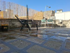 a pair of chairs and a table on a patio at Borghetto sant'irene in Erchie