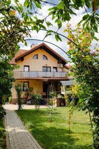 a house with a garden in front of it at Casa Ienciu in Sibiu