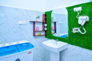 a bathroom with a sink and a mirror at Ella Black Bridge Grand View Cottage Sri Lanka in Ella +77 photos
