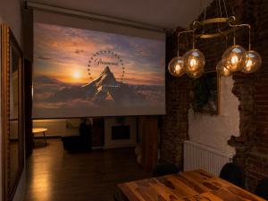 a large projection screen on a wall in a room at Lev Or Aparthotel in Bucharest