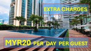 a swimming pool in the middle of a city at Soho Suites KLCC by Leala in Kuala Lumpur
