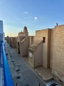 a view of a building from a balcony at Le Minaret in Kairouan