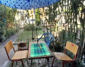 a table and chairs with a chess board on it at 10Forward apt2 in Bitola
