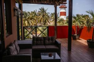 a living room with a couch and a lighthouse at Ocean & Lighthouse view apartment in Playa Venao