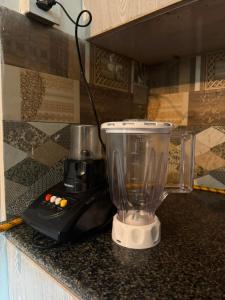 a blender sitting on top of a counter at Baam-E-Noor , Pine Tree Resort , Margalla Hills Islamabad in Harīpur +27 photos