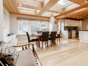 a kitchen and dining room with a table and chairs at Mill View in Aberfeldy