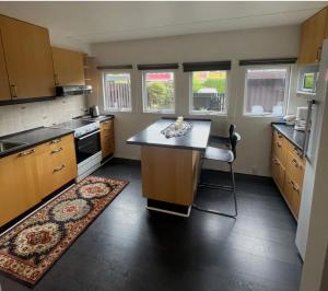 a kitchen with a large island in the middle at Family home in Greve