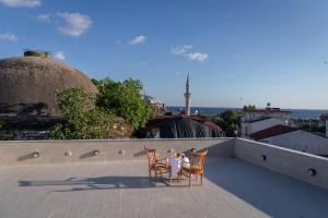 a table and two chairs sitting on a roof at Basileus Hotel in Istanbul