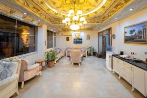 a salon with a waiting room with chairs and a ceiling at Basileus Hotel in Istanbul