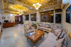 a living room with couches and a coffee table at Basileus Hotel in Istanbul
