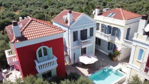 an aerial view of a house with a swimming pool at Villas Thassos in Limenaria