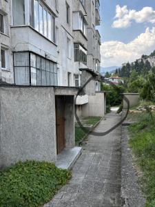 an empty street in front of a building at Orpheus and Eurydice in Smolyan