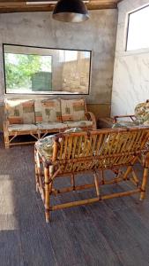 a room with a bench and a couch and a window at Chacara Mansao completa 28 pessoas TOMORROWLAND in Itu