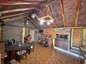 a living room with a table and a dining room at El rancho in Parana