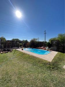 a swimming pool in a yard with a light above it at El rancho in Parana