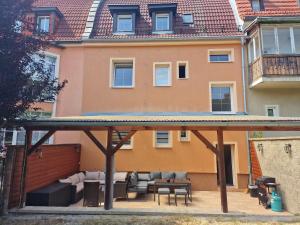 a house with a large patio in front of it at Zelená in Františkovy Lázně