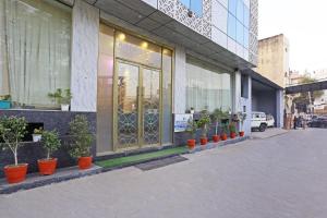 a store front with potted plants in front of it at Hotel Ronit Royal - Delhi Airport in New Delhi