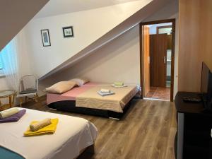 a room with two beds and a staircase at Villa Miranda - Croazia in Omiš