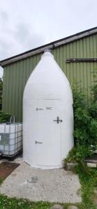 a large white garage with the words we at Tipi tent met 2 persoons luchtbed in Sneek +3 photos