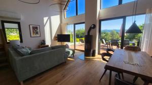 a living room with a couch and a table at Chata Vista in Rožnov pod Radhoštěm