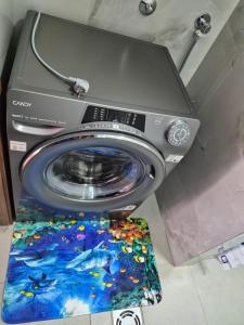 a washing machine sitting on top of a toilet at Komarnica Willage home in Šavnik
