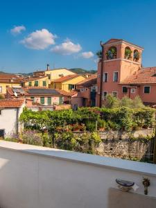a view of a city from a balcony at Marieta Rooms in Sarzana