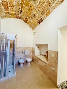 a bathroom with a toilet and a sink and a shower at B&B NONNA TINA in Gemini +96 photos
