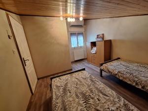 an empty room with a bed and a window at Gite de la véore in Chabeuil