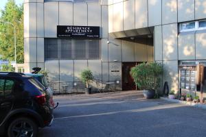 a car parked in front of a building at Résidence Appartment Gebenstorf in Gebenstorf