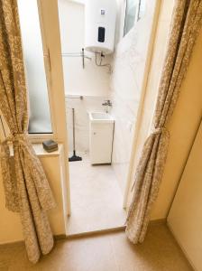 a bathroom with a shower and a toilet and a sink at Roca Playa Mogan in Puerto de Mogán +8 photos