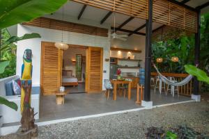 a dining room and living room of a house at Villa Lapa 10-15 min walking to the beach in Punta Uva