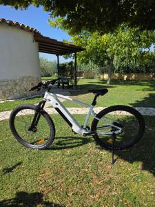 a bike parked on the grass in a park at La Vecchia Stalla B&B in Narni