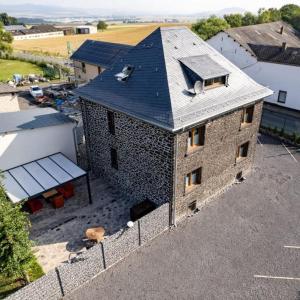 an aerial view of a brick building with a roof at Mein alter Bauernhof Strassburgerhof in Welling