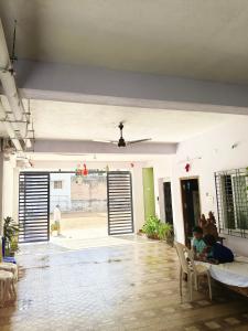 a child sitting in a chair in a living room at Hotel Jyothi Kumar Royal ac rooms in Srikalahasti